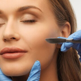 Woman closing her eyes for dermaplaning treatment
