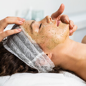 Woman with head tilted back during medi-facial