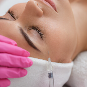 Woman calm with her eyes closed as she recieves injection